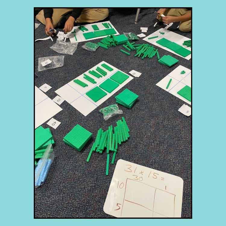 Using base tens blocks to do two-digit by two-digit multiplication