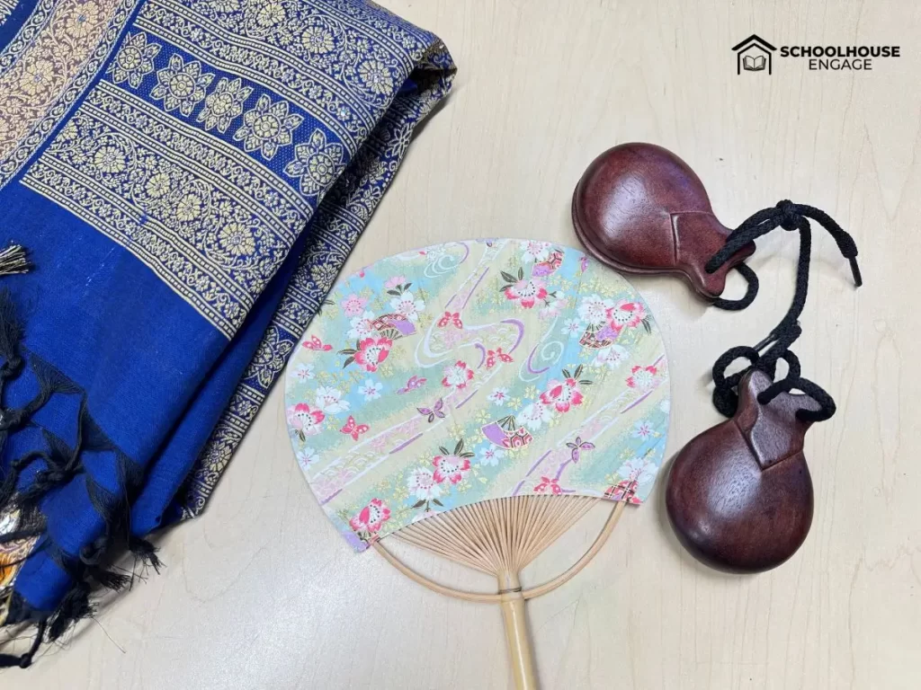 Scarf from India, castanets from Spain, and fan from Japan. Realia for Geography lesson for upper elementary