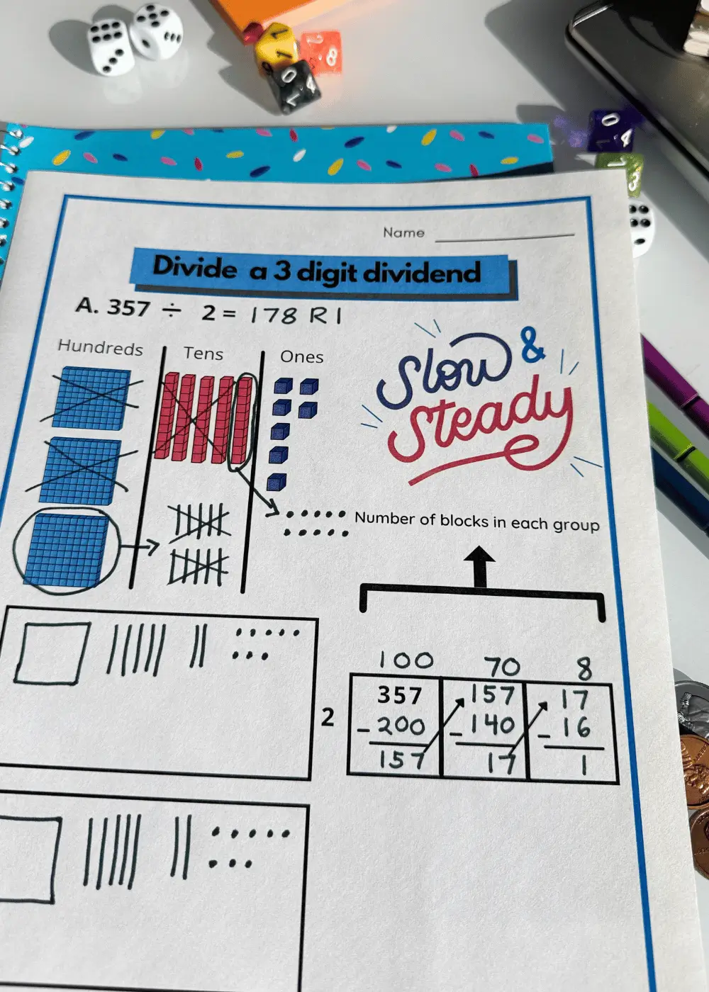 Long division with base tens blocks area model method worksheet on desk with math manipulatives