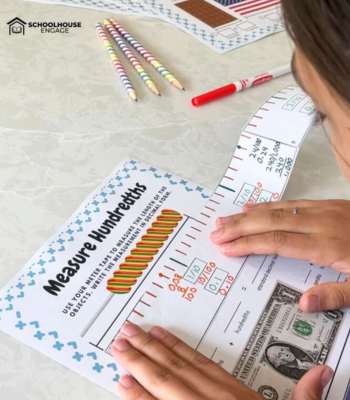 Student measuring with a diy paper meter tape to learn decimals and fractions equivalency