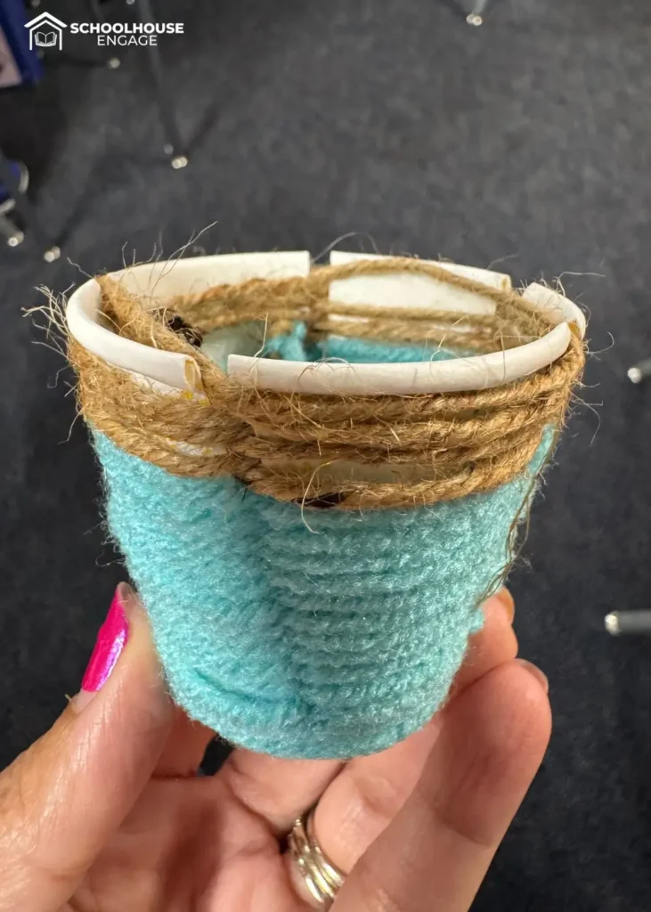 Native American basket craft using a dixie cup and yarn